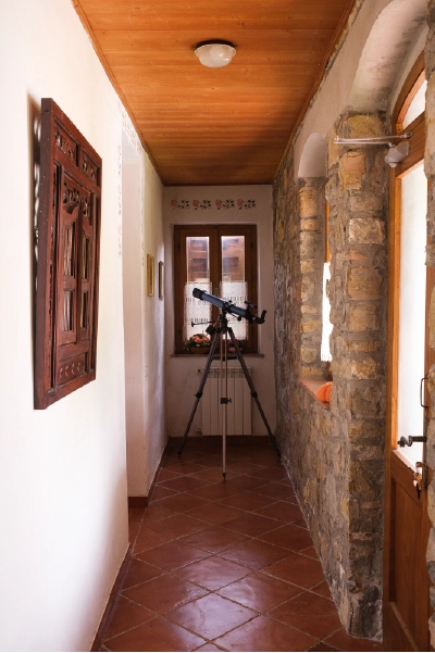 A man sitting in the room in old romantic cottage