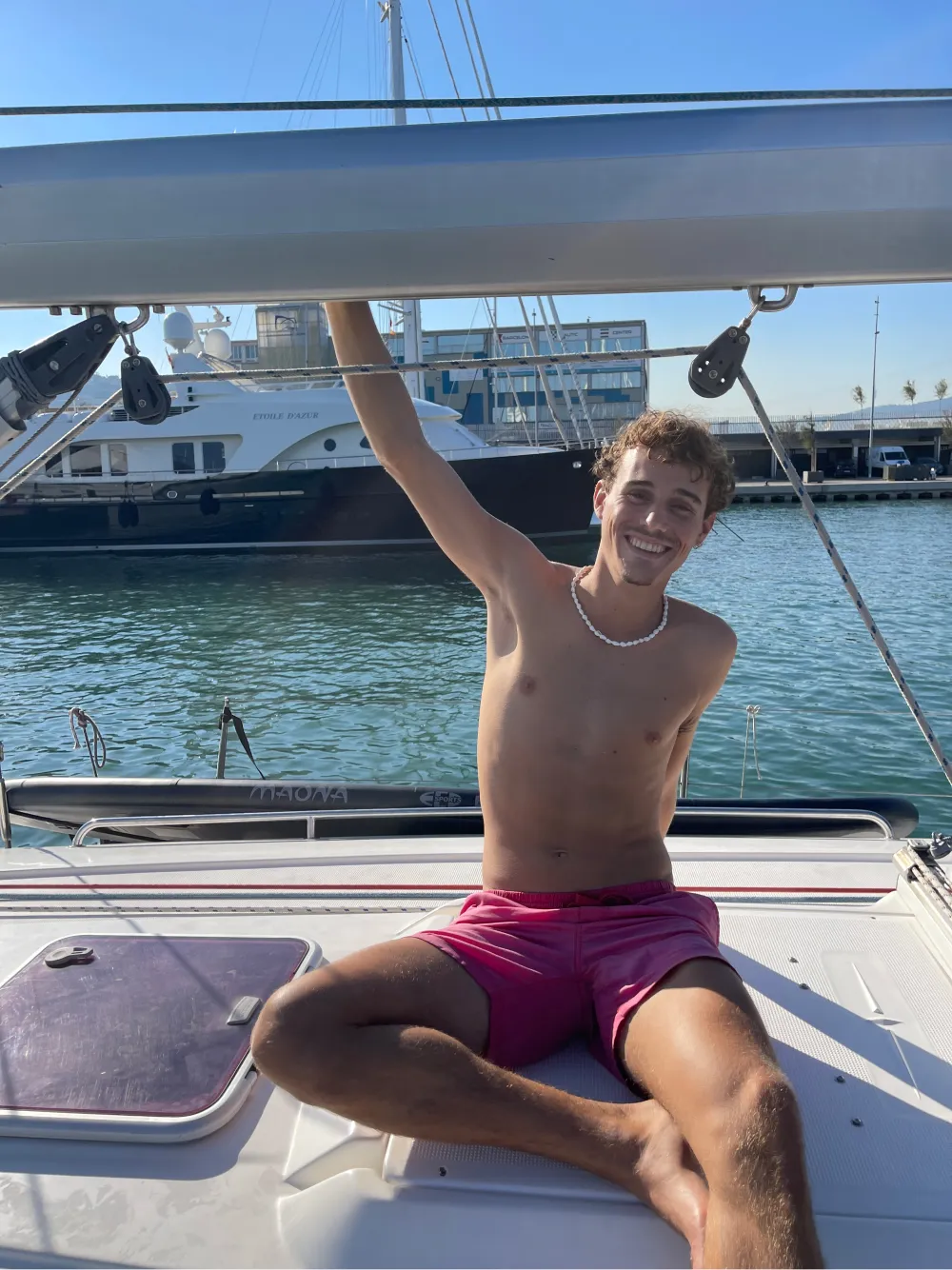 a young guy enjoying a boat trip in barcelona