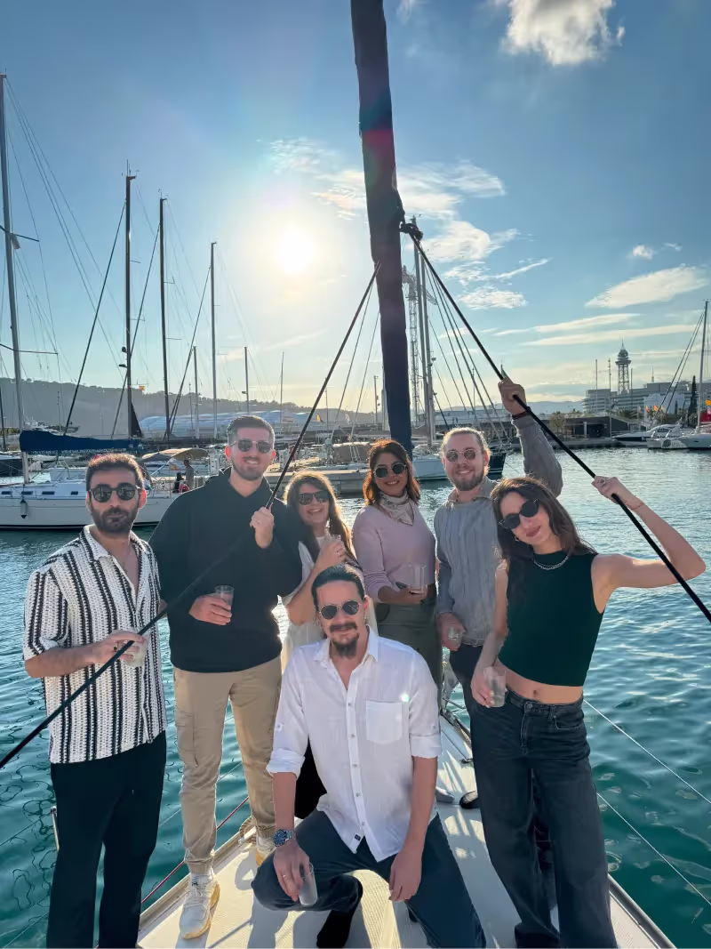 a group of young people having fun on a boat in barcelona