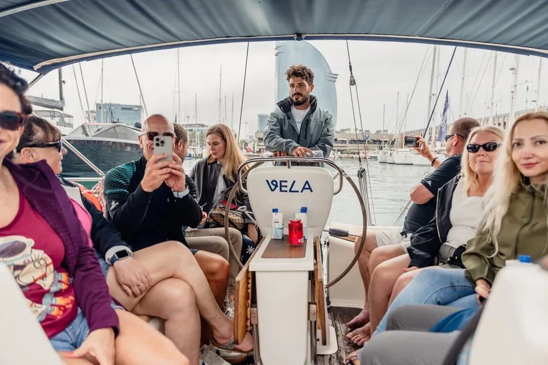 a group of sailors on a boat trip in barcelona