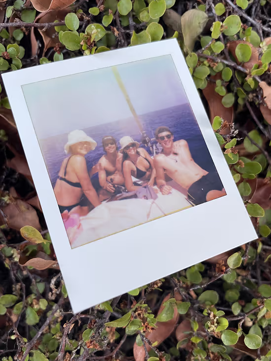 A polaroid picture of a private group boat trip
