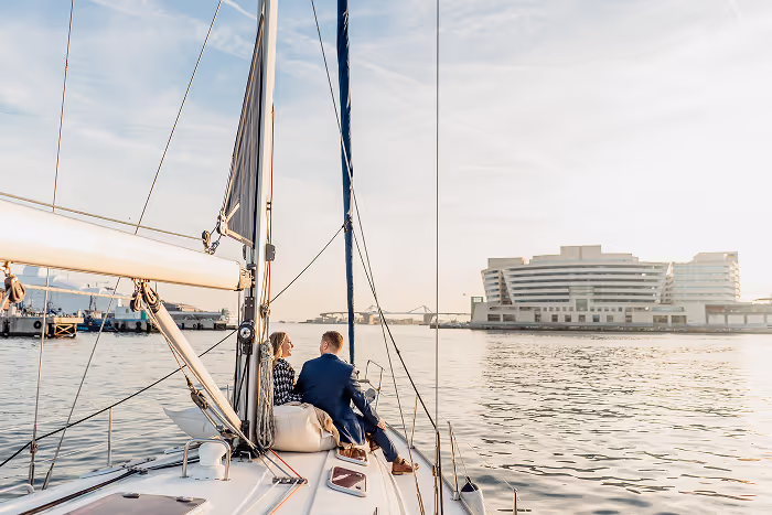 2 guests cruising in barcelona sea in may