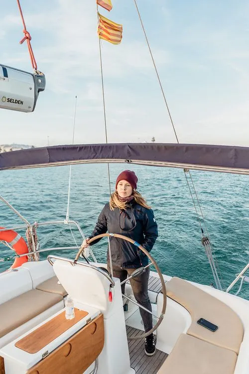 a captain and a couple sailing in barcelona