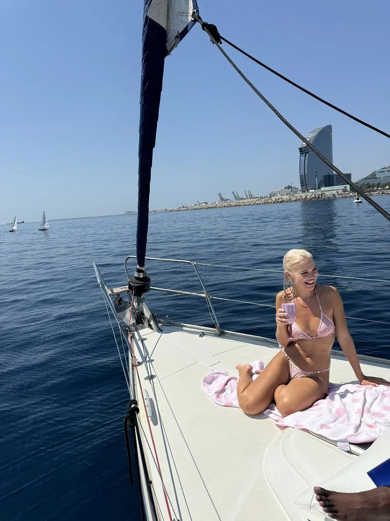 a girl on a sailing tour in barcelona