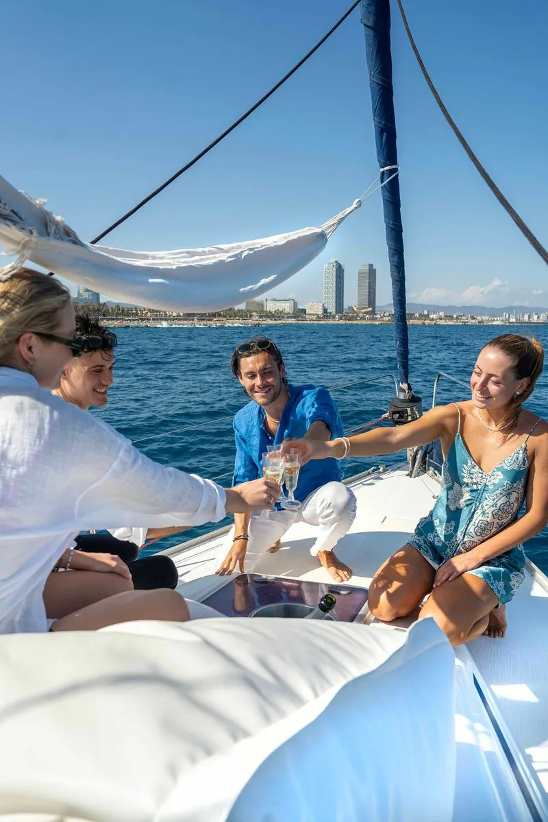 a group of friends on a boat tour in barcelona