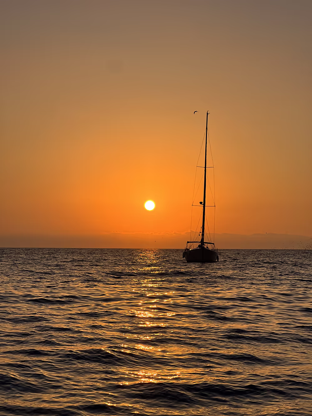 Sunrise over the Mediterranean Sea near Barcelona with calm waters