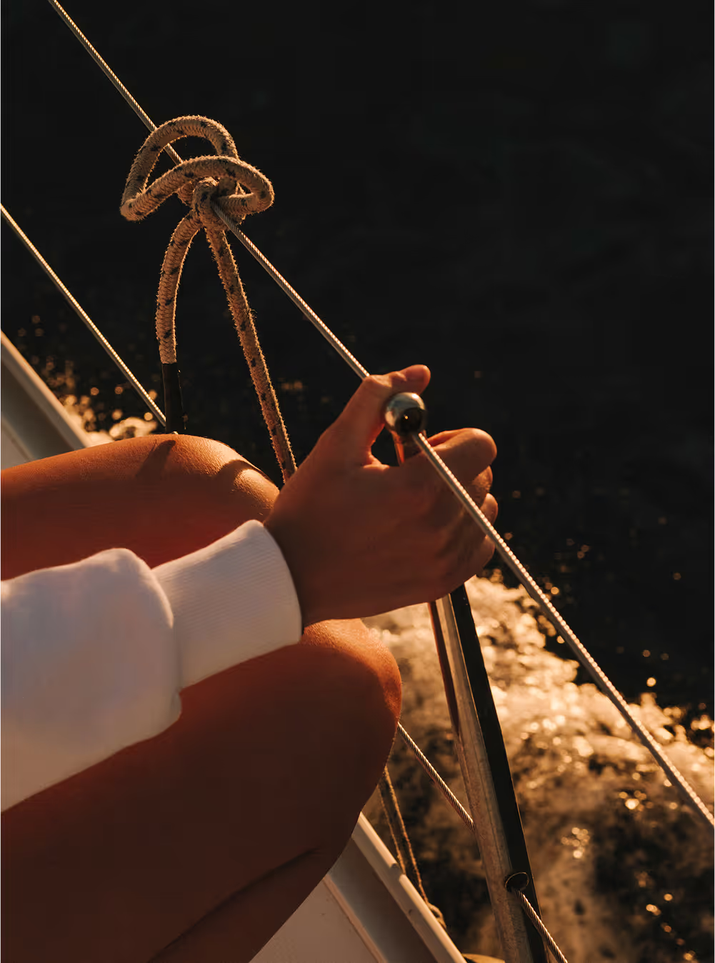 The skyline of Barcelona glowing during early morning sunrise from the water
