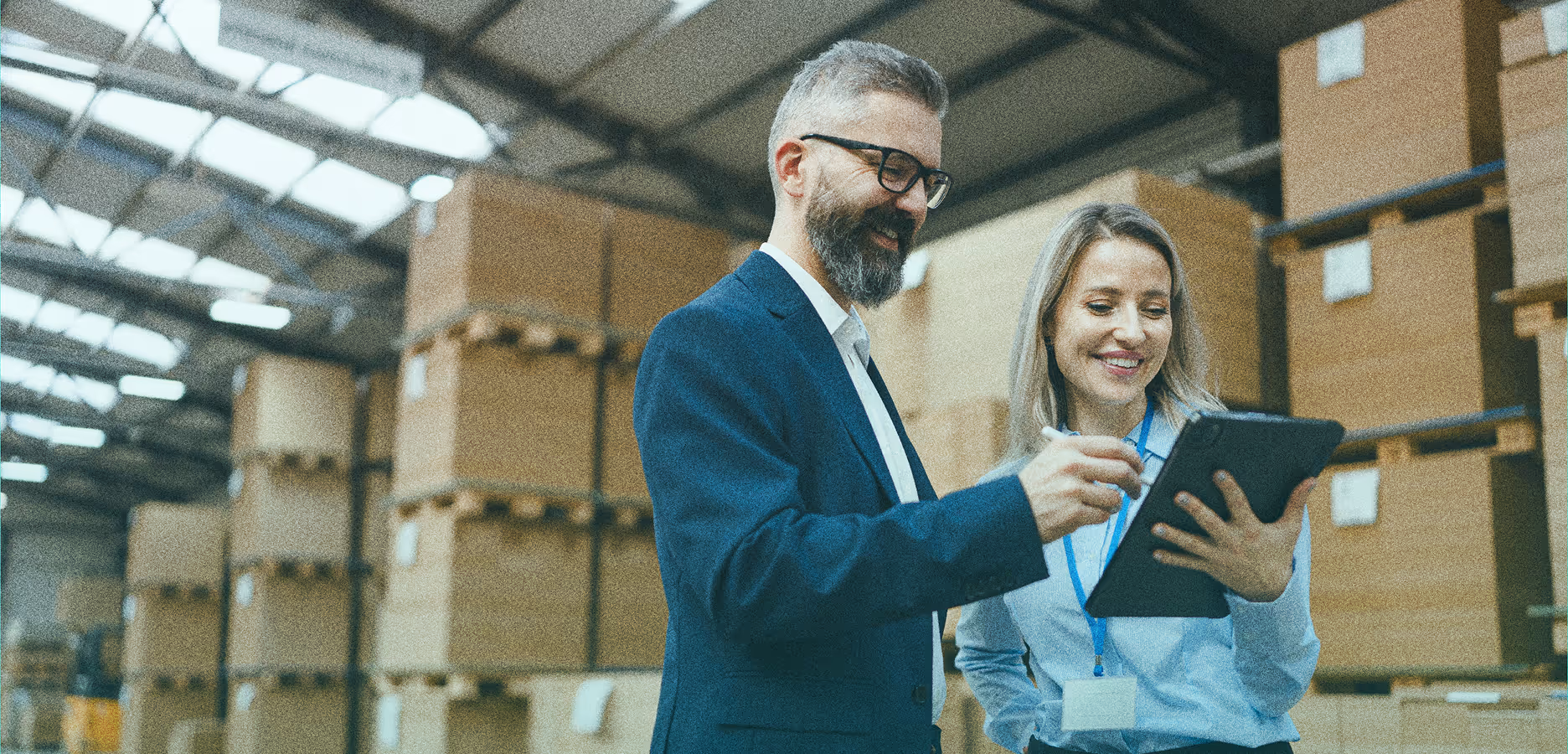 2 people working on tablet