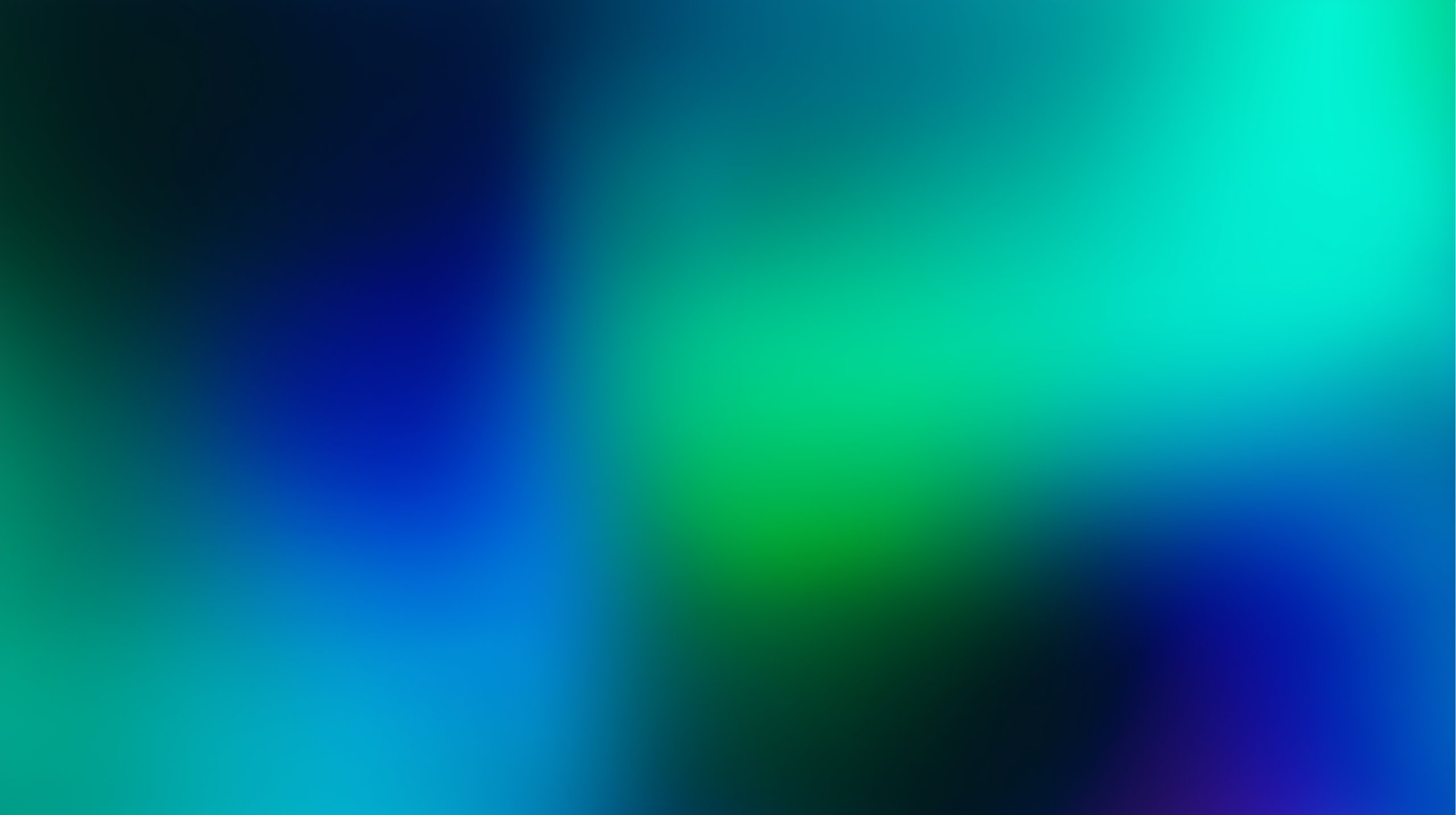 Abstract gradient background blending shades of blue, green, and teal with smooth transitions.