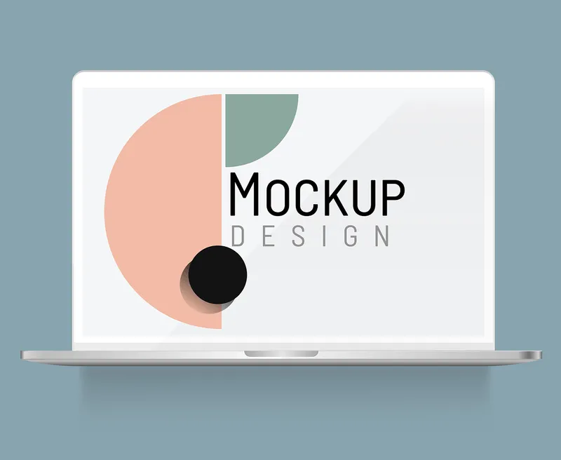 Minimalist laptop mockup with geometric graphics on screen.