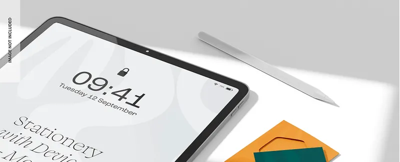 Close-up of a tablet screen with a digital clock and stylus placed nearby.