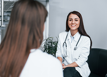 Woman doctor talking to patient
