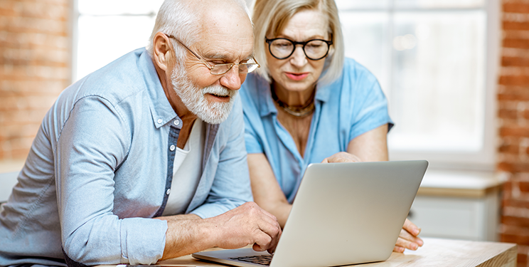 Man and woman looking at computer