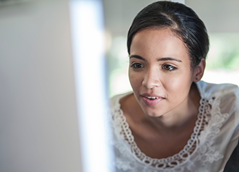 Woman reviewing Remittance Advice Data