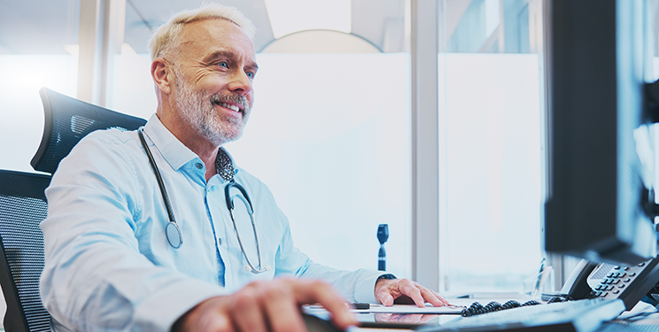 Hospital admin on computer