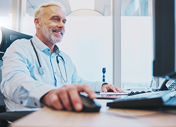 Hospital admin on computer