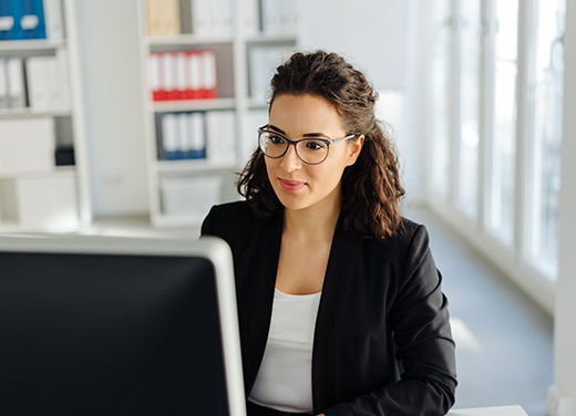 Professional coding woman at computer