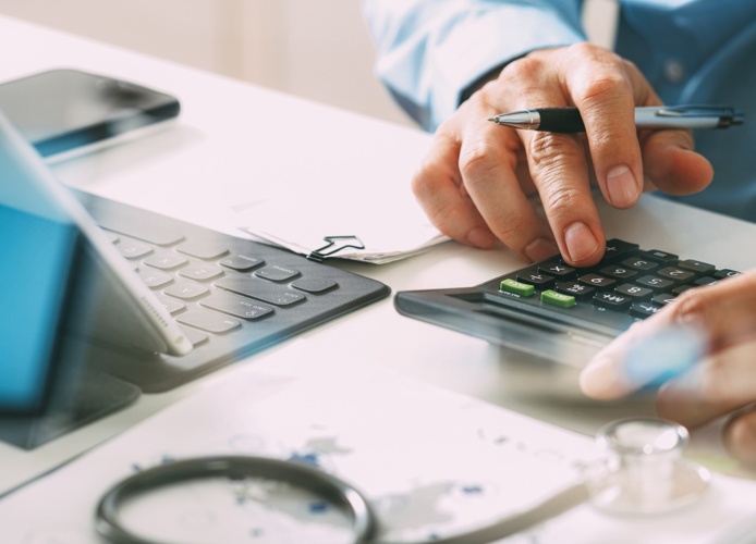 Man calculating lost revenue