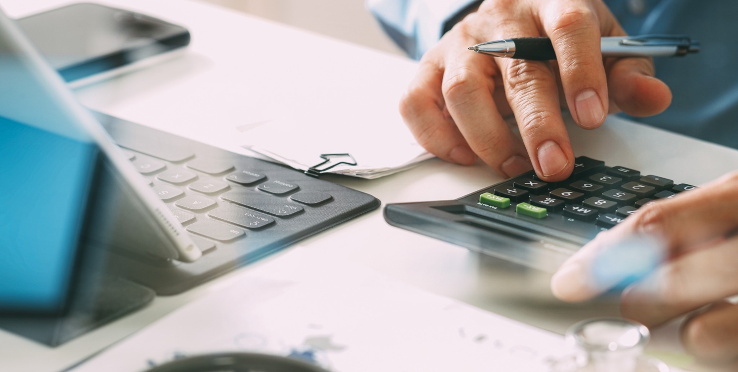 Man calculating lost revenue