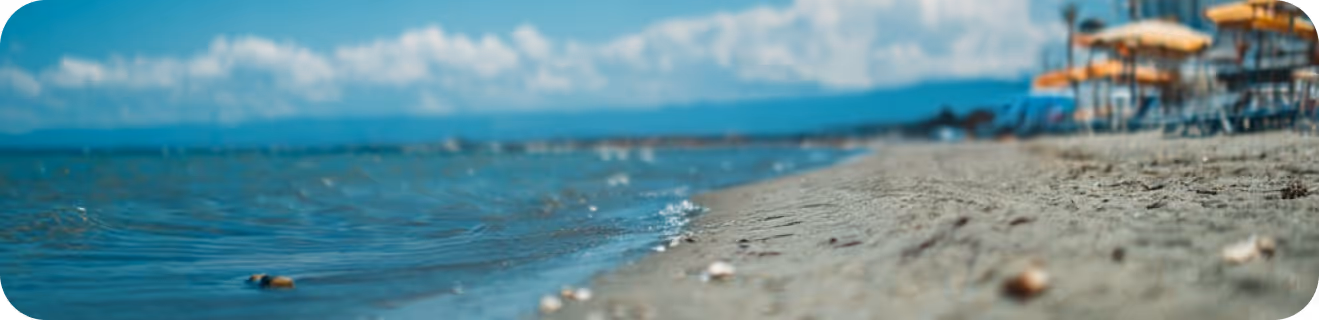 A calm beach with blue skys