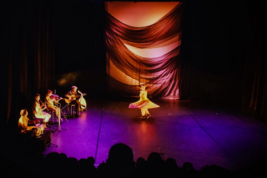 [background image] image of concert venue for a musician & band