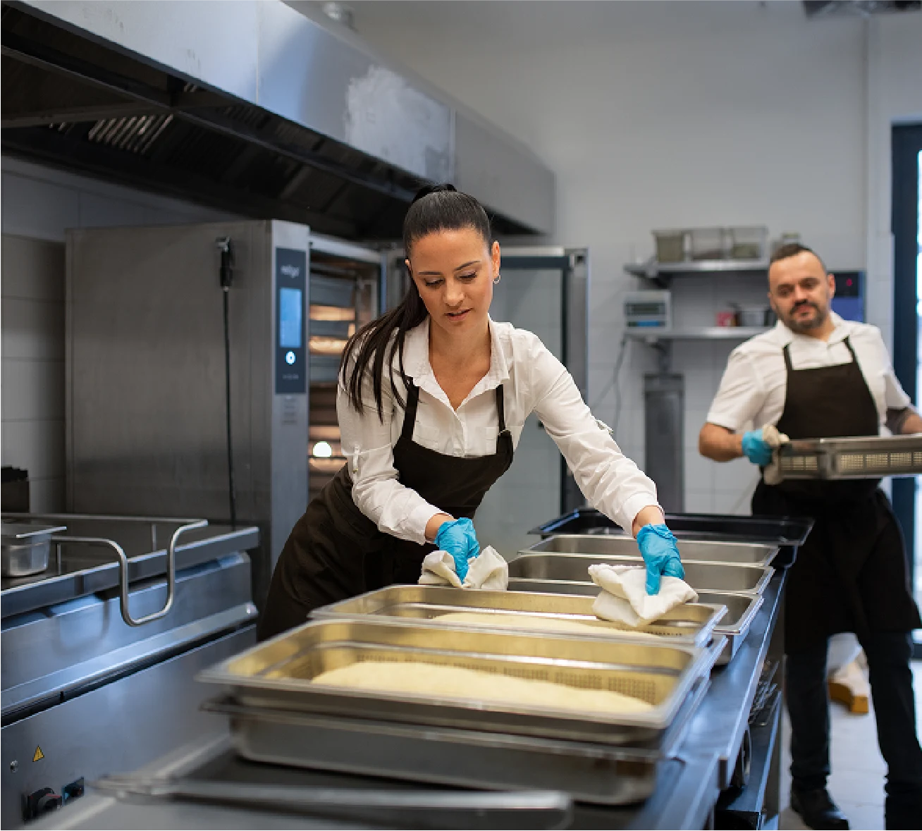 Catering staff working in kitchen