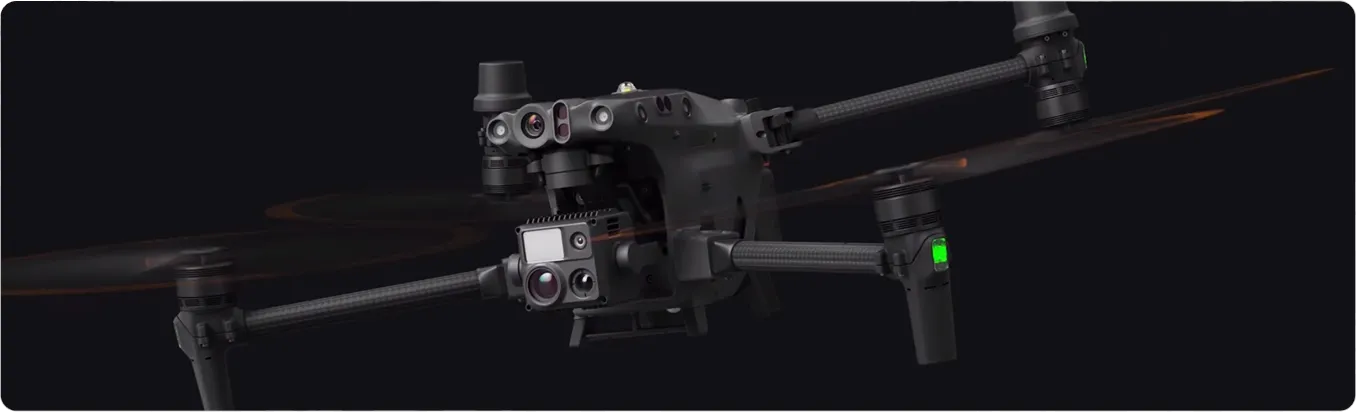 Close-up of a professional-grade quadcopter drone with multiple cameras and sensors on a black background.