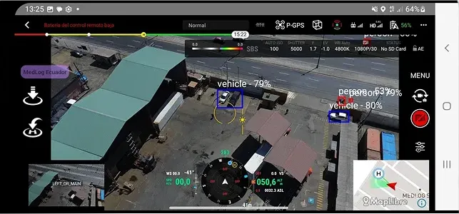 Drone interface showing aerial view of vehicles with detection boxes and confidence percentages on a street near buildings.
