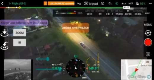 Drone surveillance interface showing a road with two cars at night, including GPS, altitude, speed, and map data.