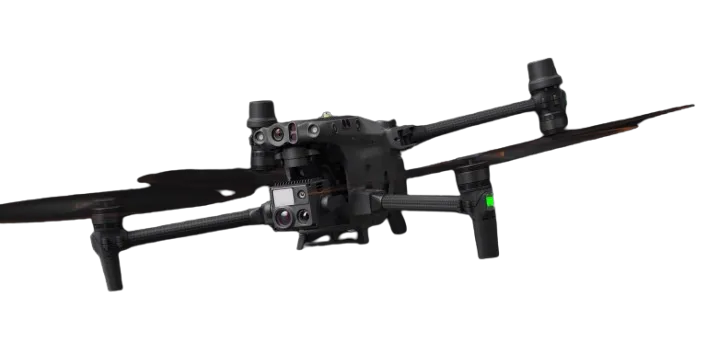 Black quadcopter drone with four propellers and multiple sensors on a black background.