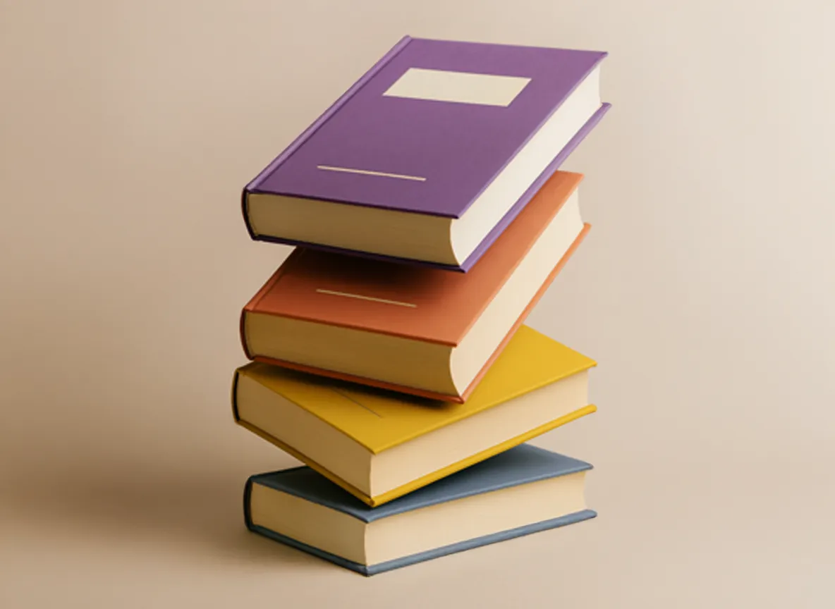 Stack of four hardcover books with covers in purple, orange, yellow, and blue on a plain background.