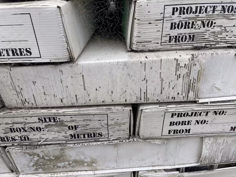 Stack of old, weathered fluted core trays