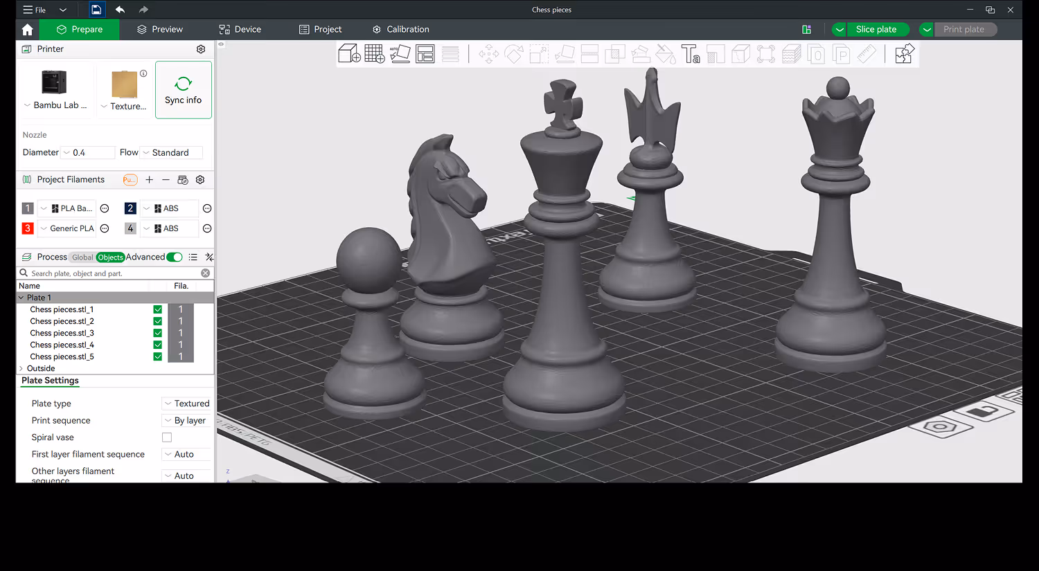 3D printing software interface showing five chess piece models on a textured plate for printing preparation.