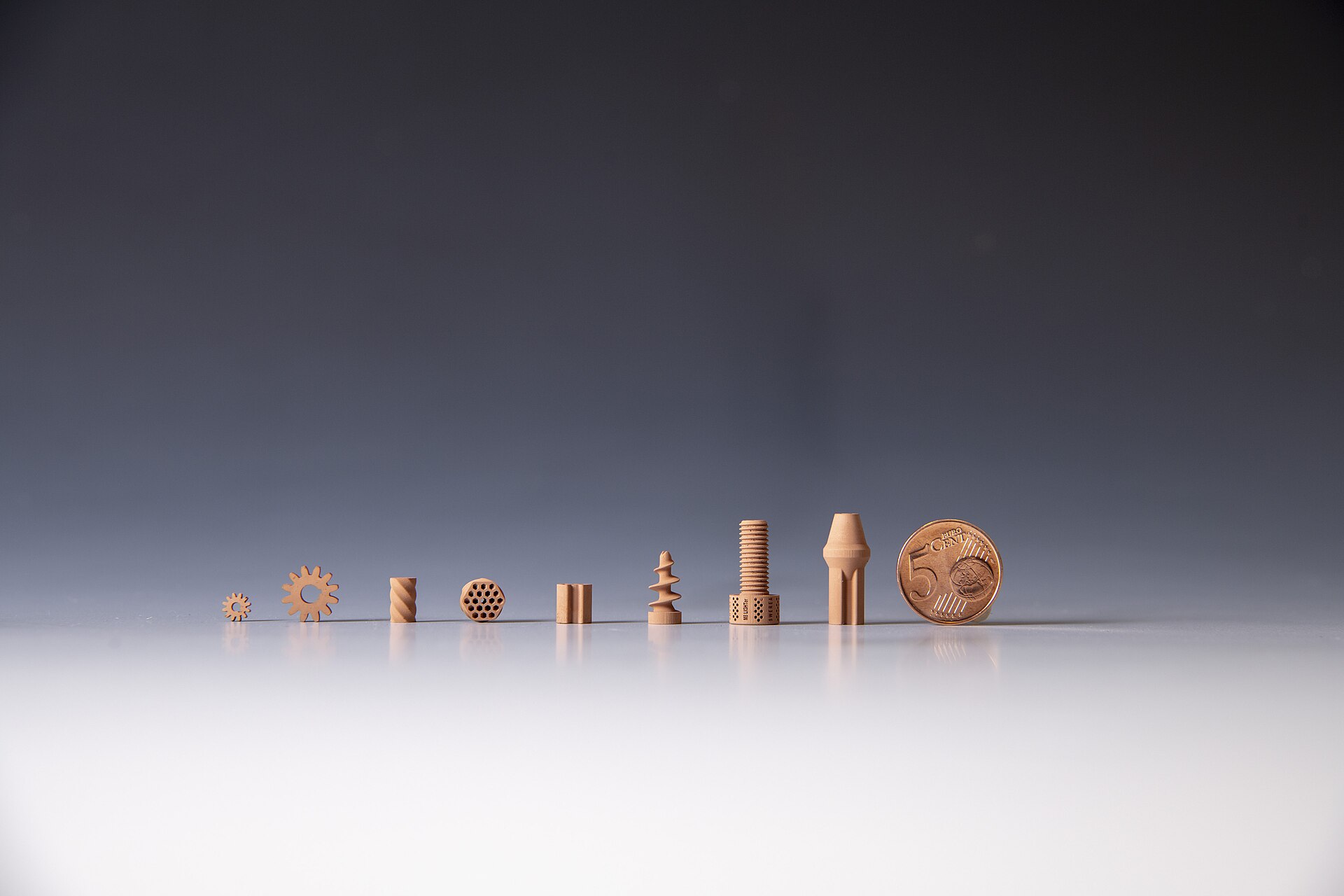 Ceramic parts that were 3D printed using simulated lunar regolith as part of an ESA project ("3D-printed ceramic parts made from lunar regolith" by European Space Agency / CC BY-SA 3.0 IGO via Wikimedia Commons)
