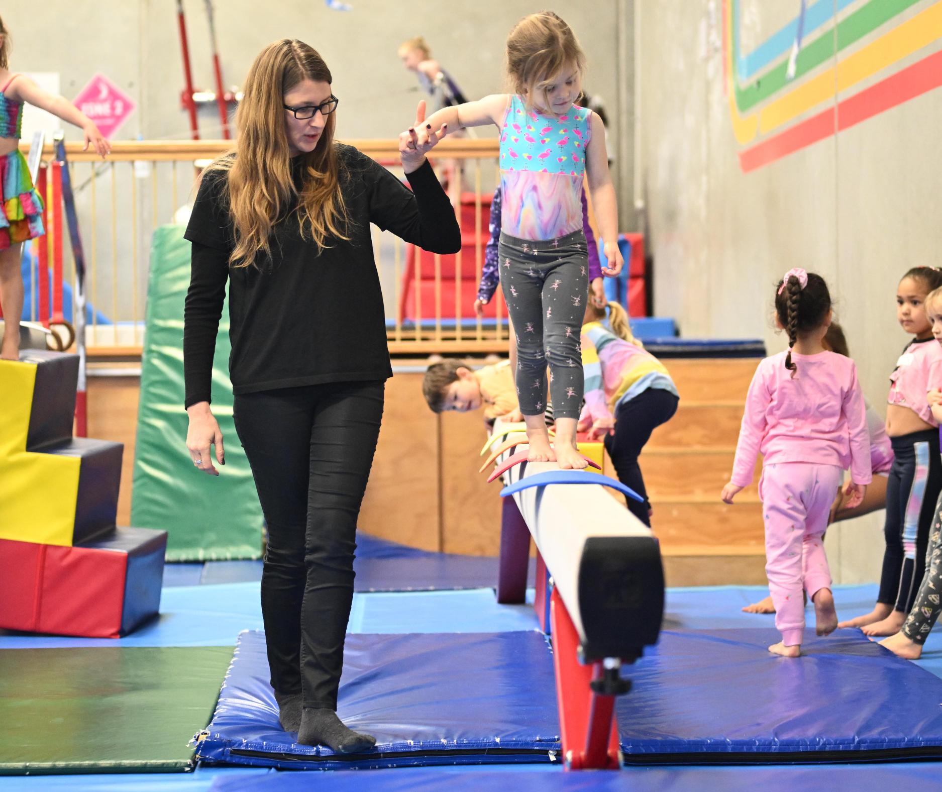 Children at play on the gymnastics equipment at Xpressions Gymnastics during a holiday programme