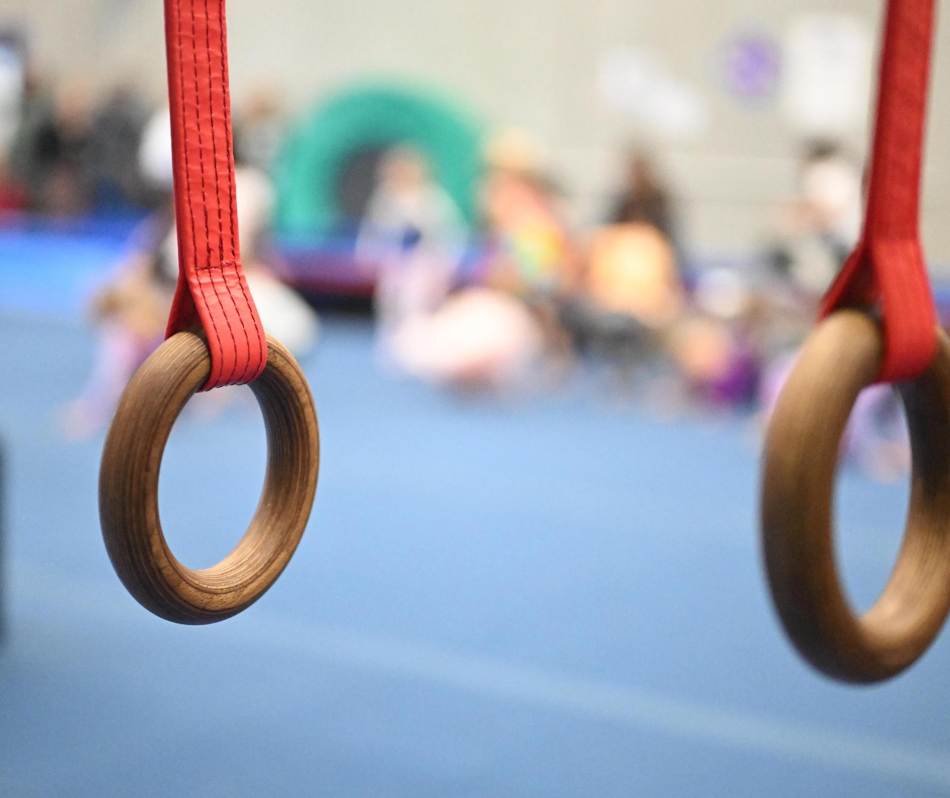 young gymnast from Xpressions Gymnastics performs an exercise during a floor routine