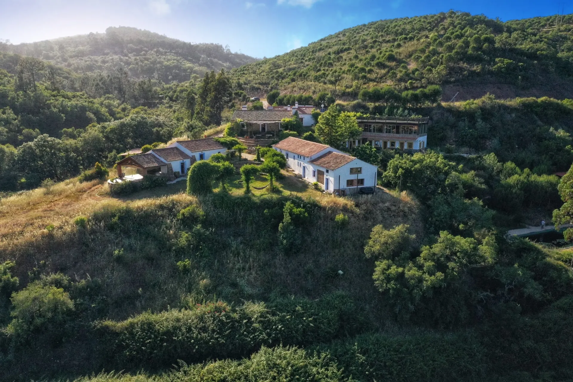 Beautiful mediterrenean nature on the hills with big house in the middle, taken from bird view