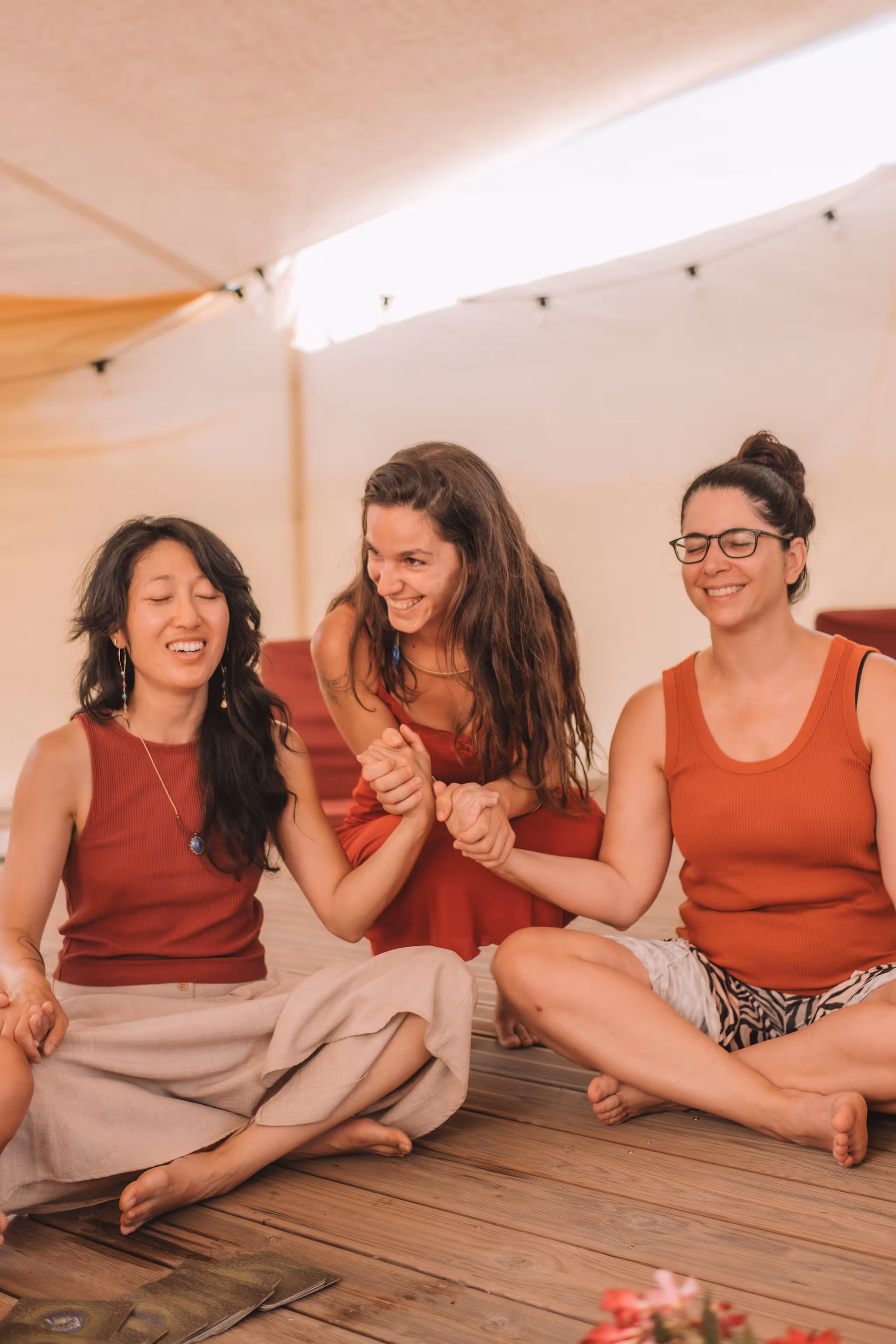 Sophie holding hands with 2 other women
