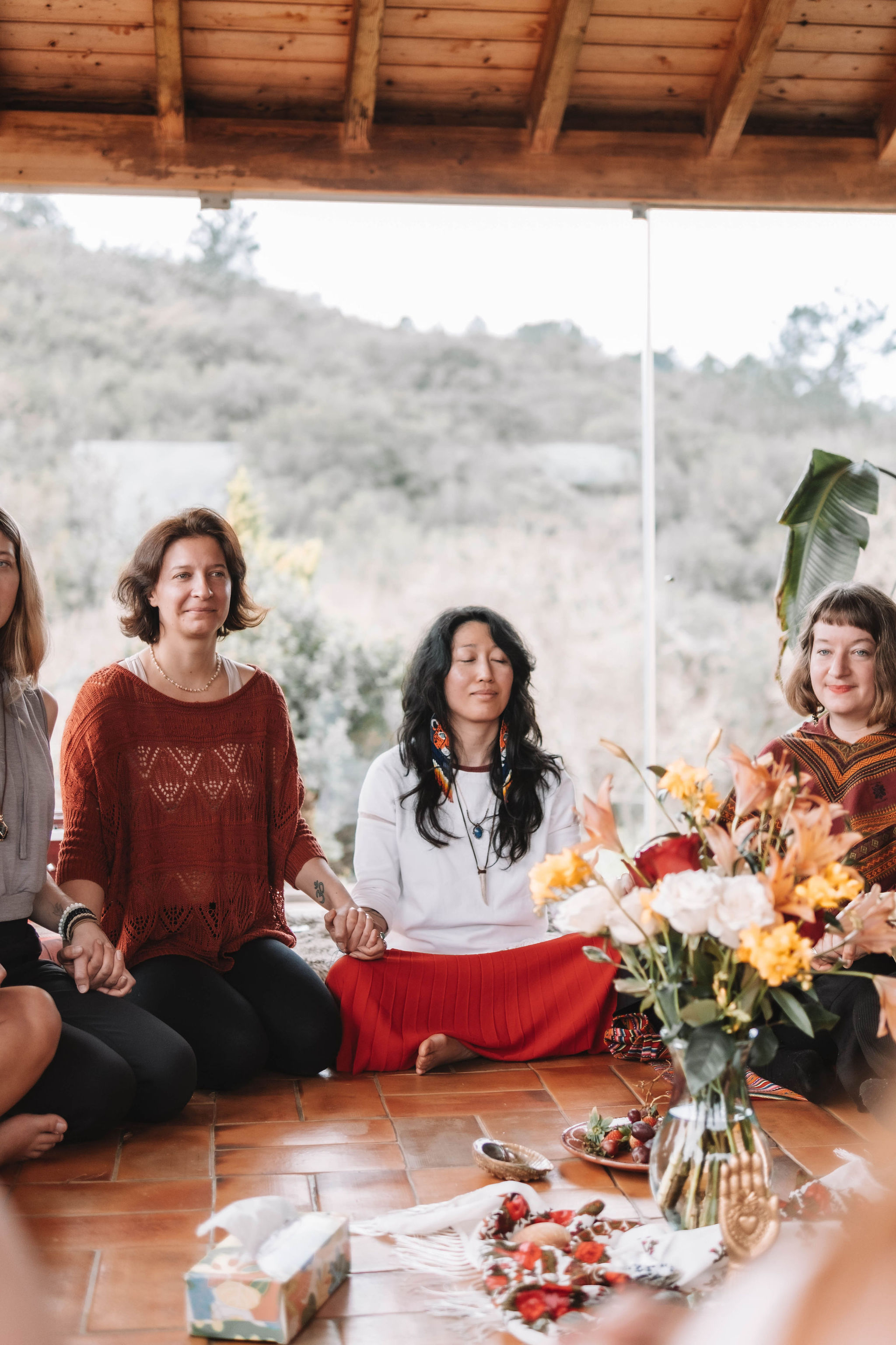 Sophie holding hands with 2 other women
