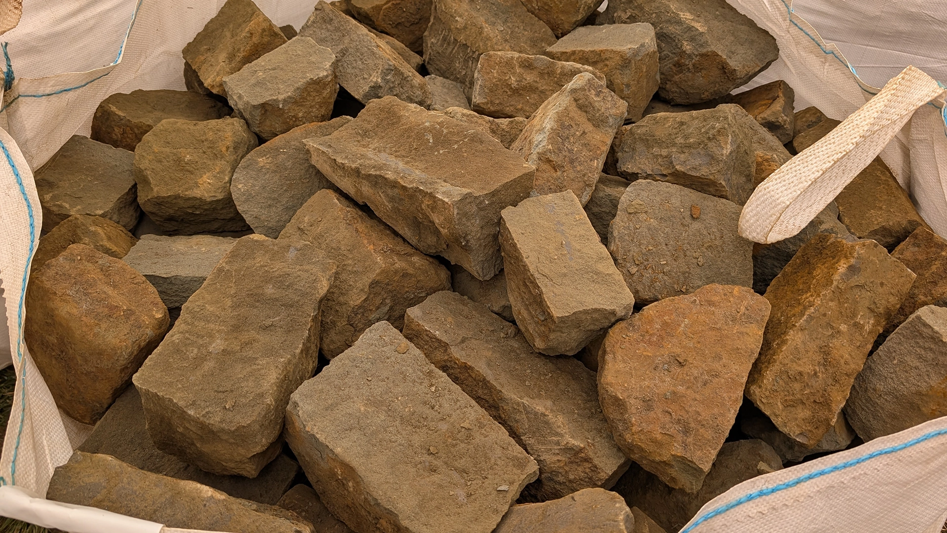 A bag of cropped ironstone, ready for use in garden and landscaping projects