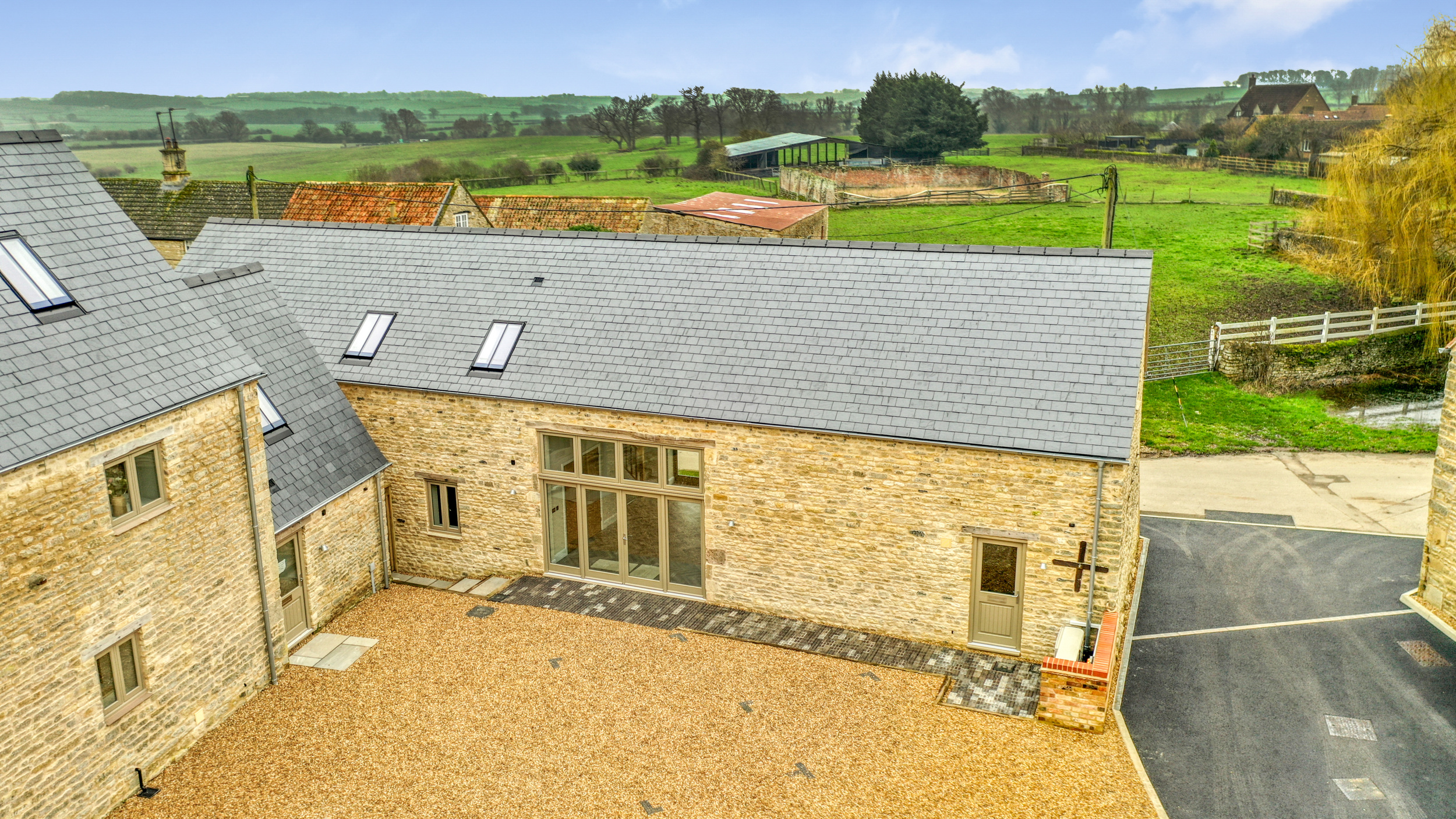 The stone barn was constructed from the reclaimed limestone on-site in Titchmarsh.