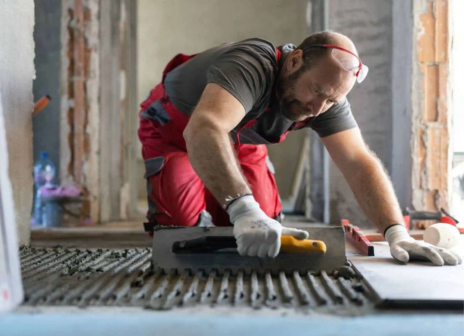 Contractor working on a construction project, boots on the ground representing small business owners in the trades.