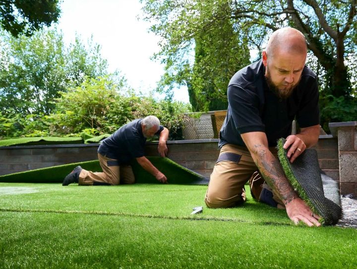 Landscaping professionals on-site performing yard work, symbolizing home service companies.