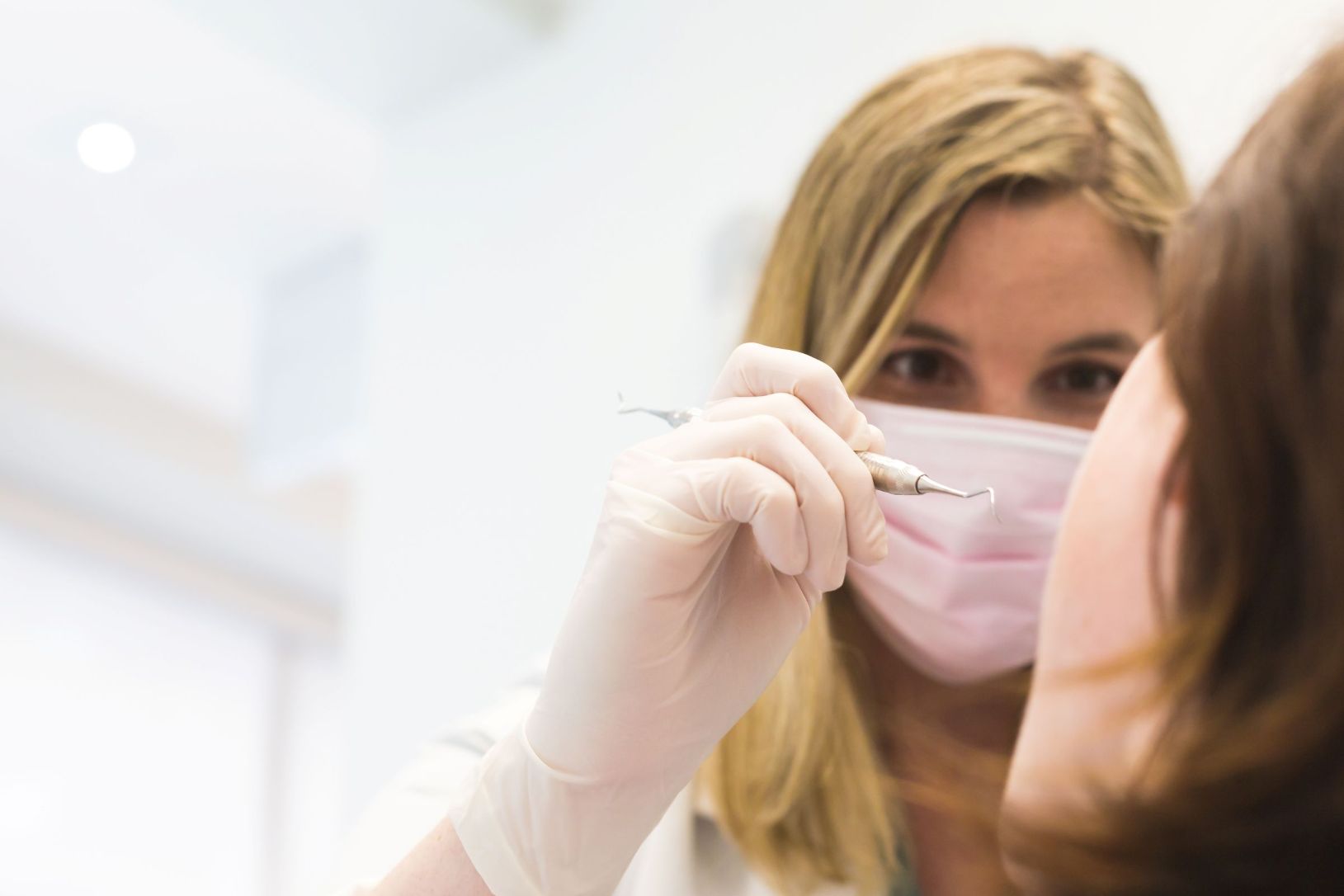 Dental professional providing treatment, symbolizing dentists who benefit from bookkeeping, tax planning, and accounting support.