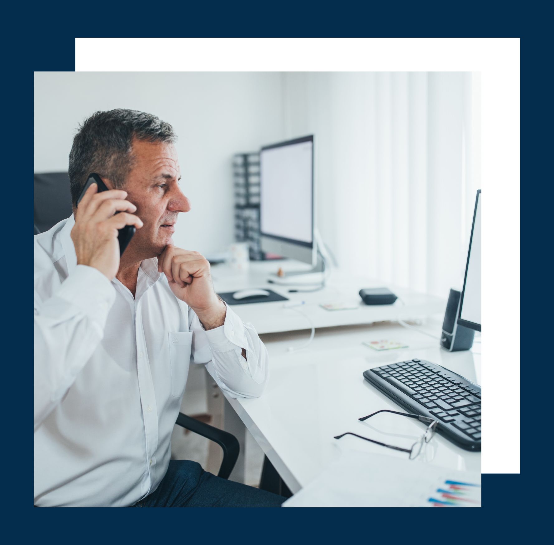 Fort Lauderdale small business owner on a phone call while in his office discussing tax planning and advisory services with a Westfront's CPA.