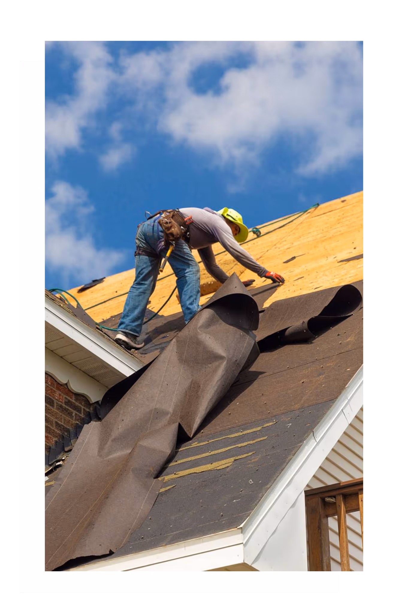 Construction worker installing roofing materials on a Fort Lauderdale job site for a project-based contractor
