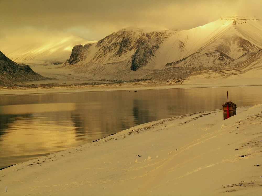 Sepia toned picture of glacier and water