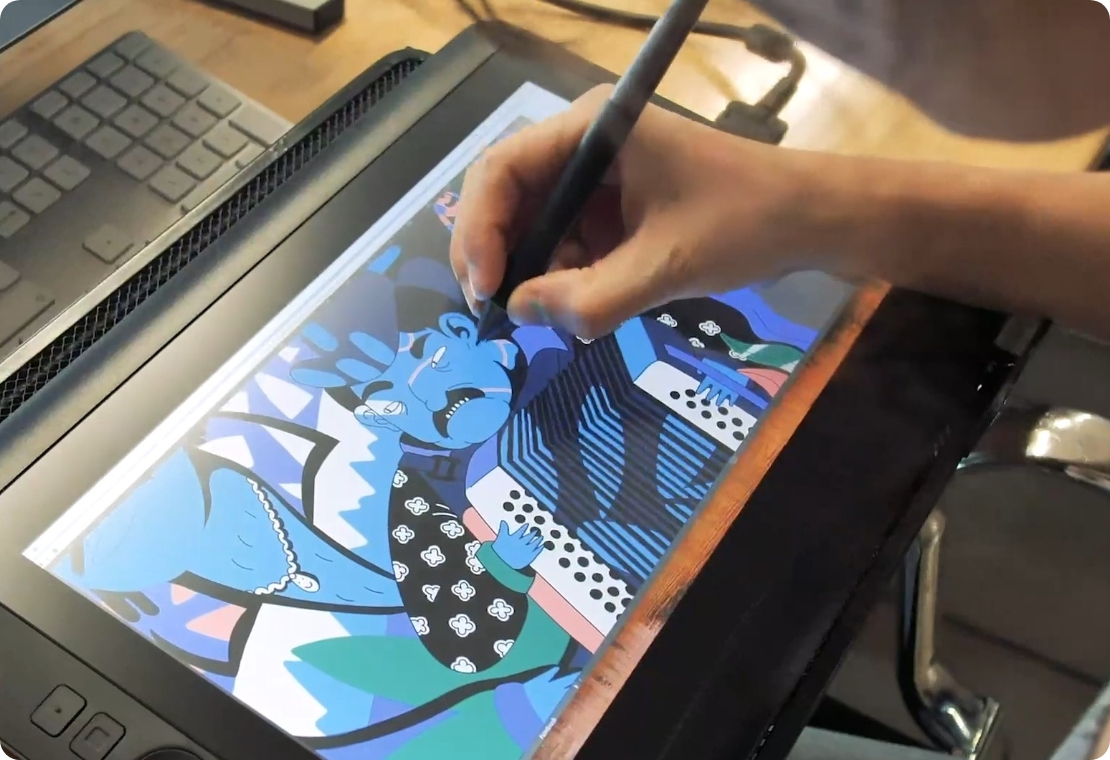 A graphic designer working on an illustration on a tablet
