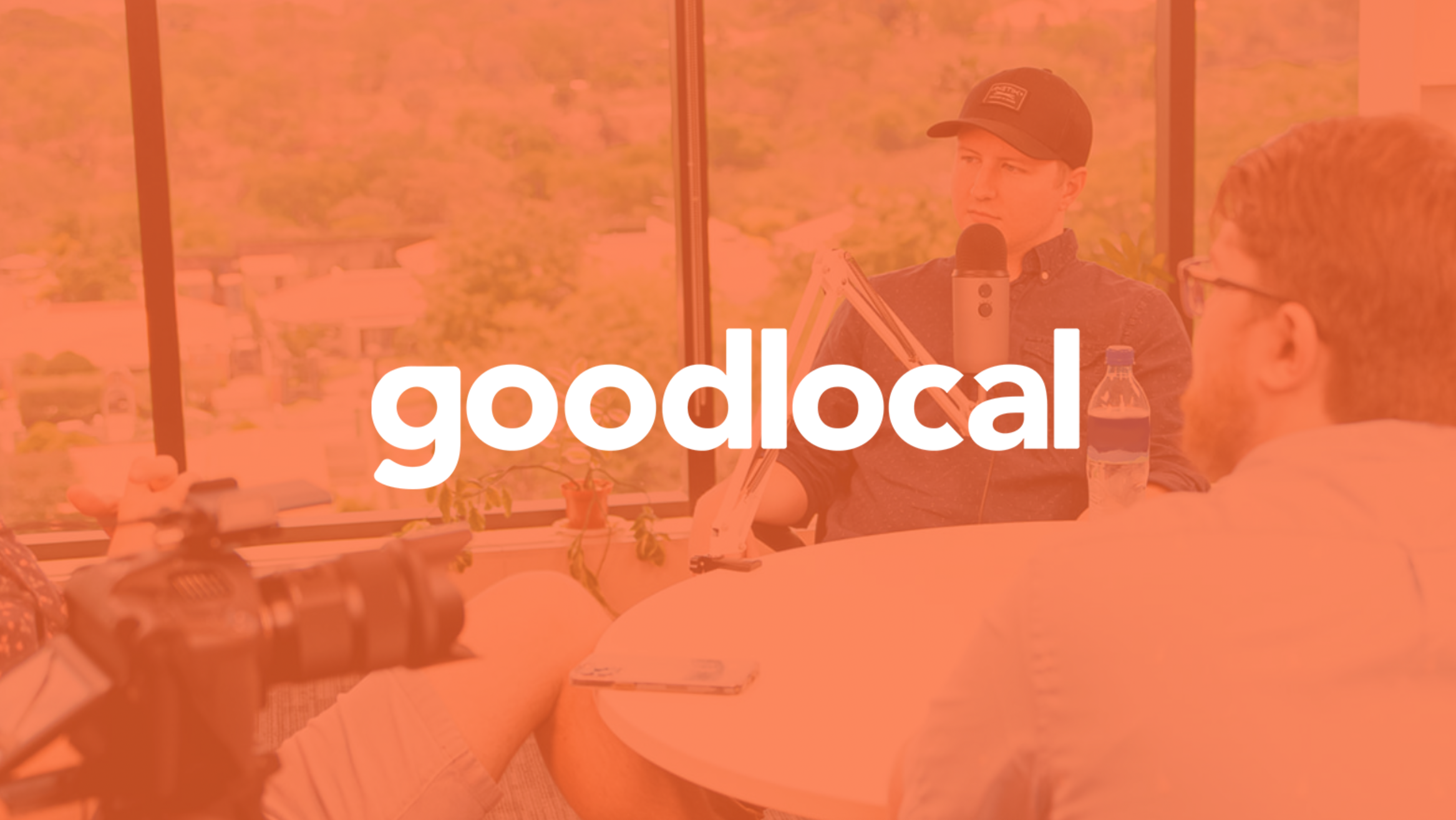 A man sitting at a table discussing business