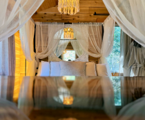 Harmony cabin bedroom with queen four-poster bed